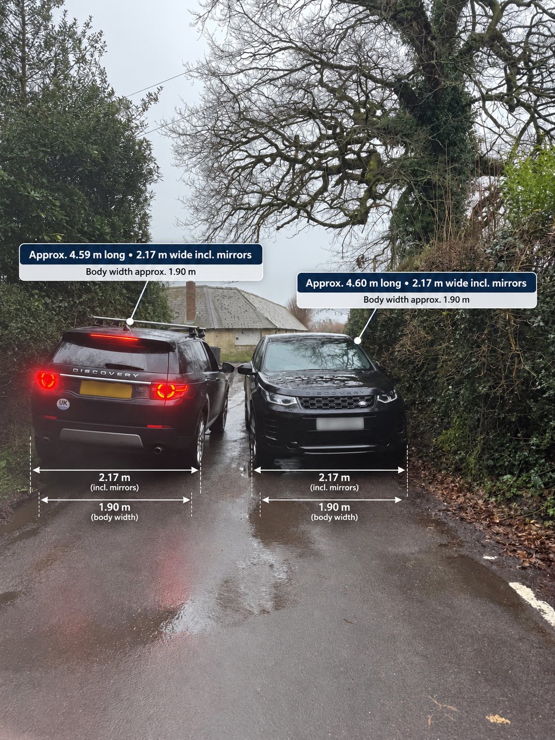 Two Land Rover Discovery Sports side by side at the Mill Lane pinch point, looking north away from Empshott Grange, each pressed against the hedge on its side of the lane.